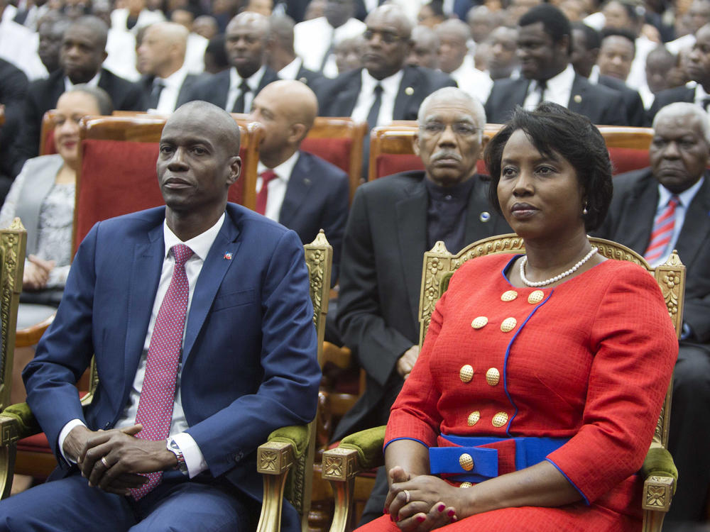 Haiti's President Jovenel Moise sits with his wife Martine during his swearing-in ceremony at Parliament in Port-au-Prince, Haiti, Tuesday Feb. 7, 2017. A judge investigating the July 2021 assassination of President Moïse issued a final report that indicts his widow, ex-prime minister Claude Joseph and the former chief of Haiti's National Police, Léon Charles, among others.