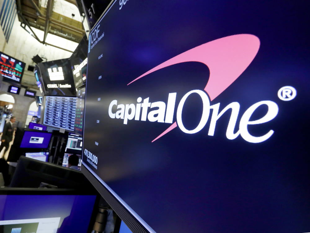 The logo for Capital One Financial is displayed above a trading post on the floor of the New York Stock Exchange, July 30, 2019. Capital One Financial is buying Discover Financial Services for $35 billion, in a deal that would bring together two of the nation's biggest lenders and credit card issuers, according to a news release issued by the companies Monday, Feb. 19, 2024.