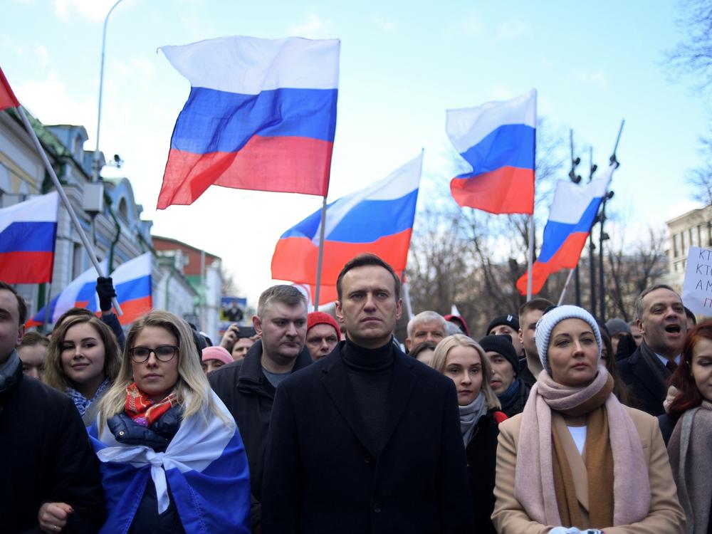 Alexei Navalny, his wife Yulia, opposition politician Lyubov Sobol and other demonstrators march in memory of murdered Kremlin critic Boris Nemtsov in downtown Moscow in February 2020.