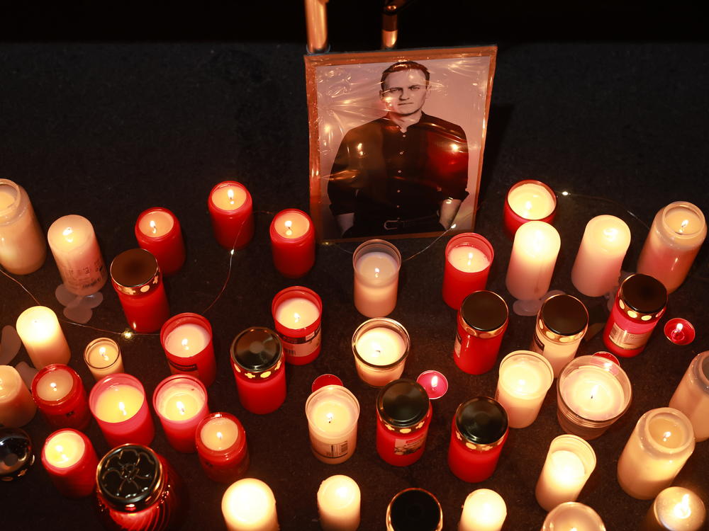 People light candles during a vigil for Navalny in front of the Russian Consulate General on February 16 in Munich, Germany.