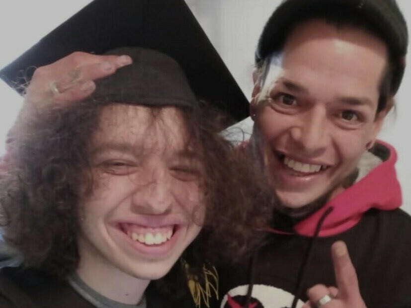 Guillermo A. Santos on his high school graduation day in 2021, with his father, Guillermo Jose Santos. The elder Santos died later the same year of a drug overdose.