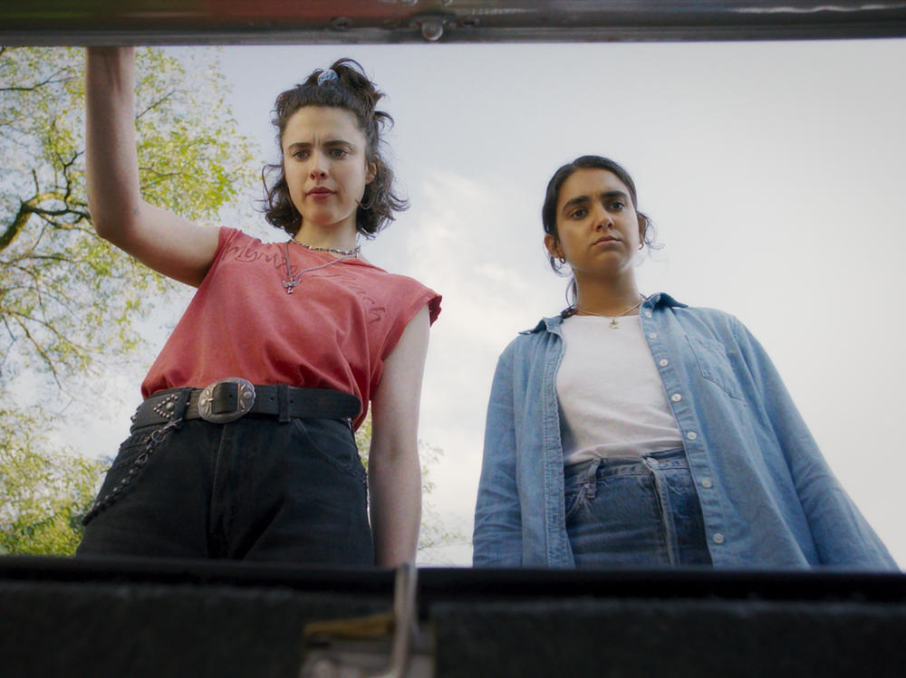 Margaret Qualley and Geraldine Viswanathan in <em>Drive Away Dolls</em>.