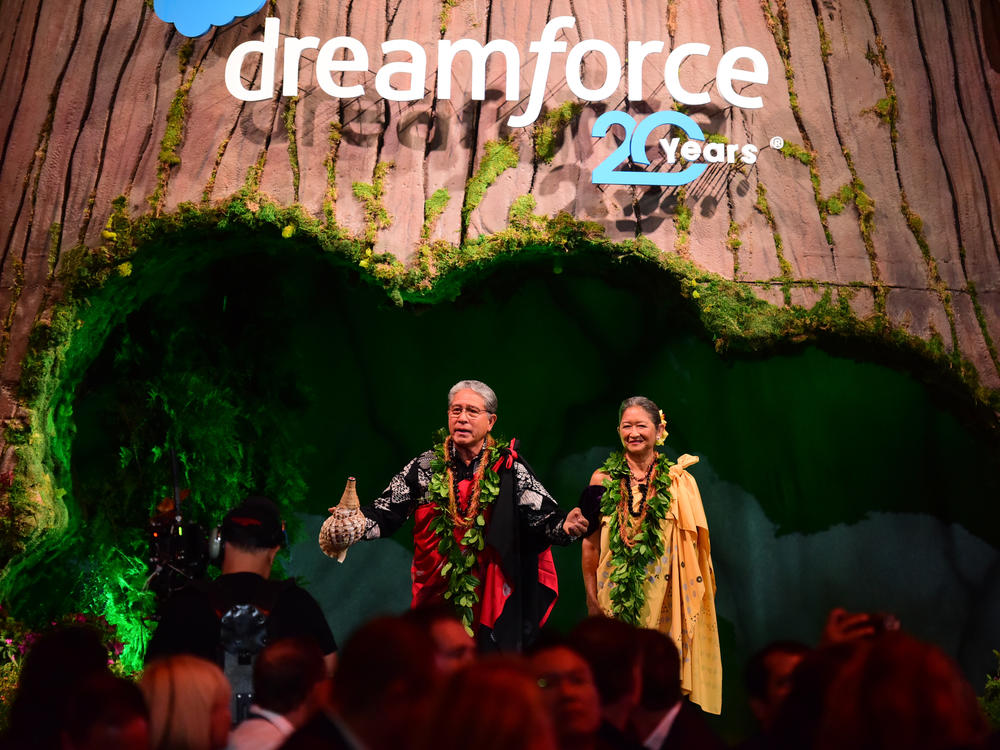 Danny Akaka Jr. and Anna Akaka address attendees during Salesforce's 2022 Dreamforce conference in San Francisco. Danny, the son of late U.S. Sen. Daniel Akaka, and Anna have been spiritual advisers to Benioff.