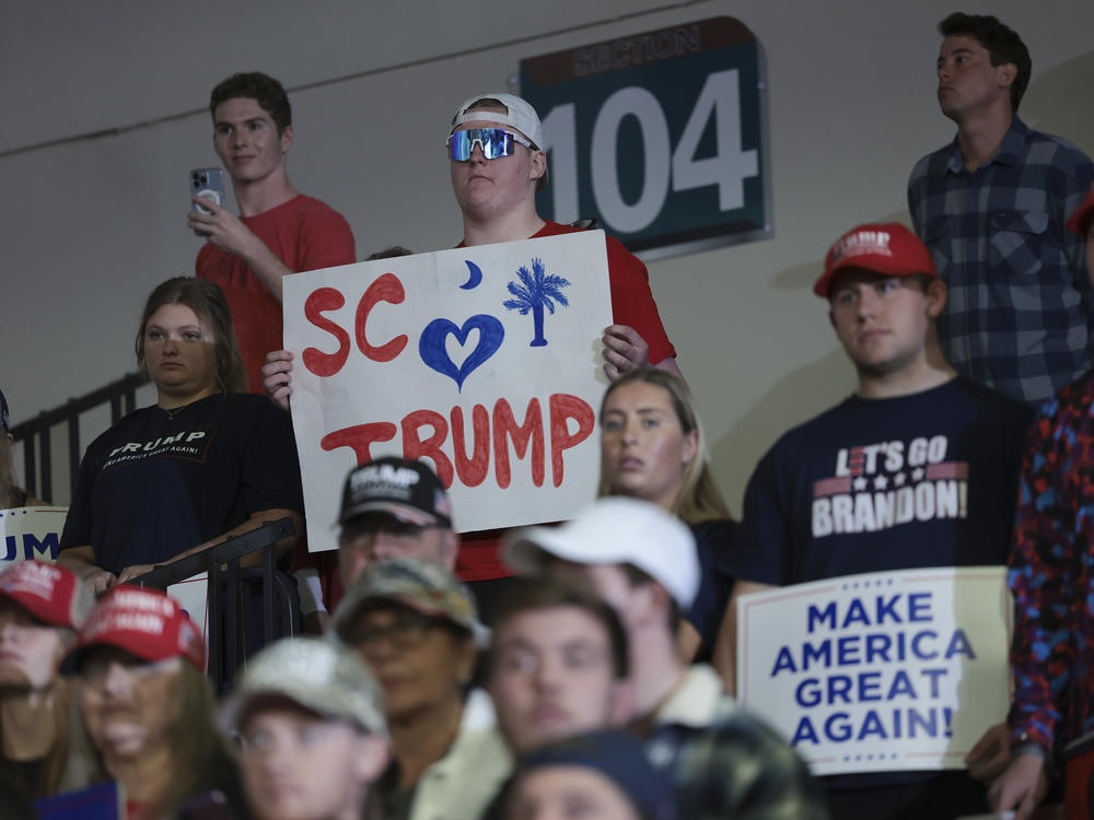 Supporters of Republican presidential candidate and former President Donald Trump listen while he speaks during a Get Out The Vote rally at Coastal Carolina University on Feb. 10 in Conway, S.C.