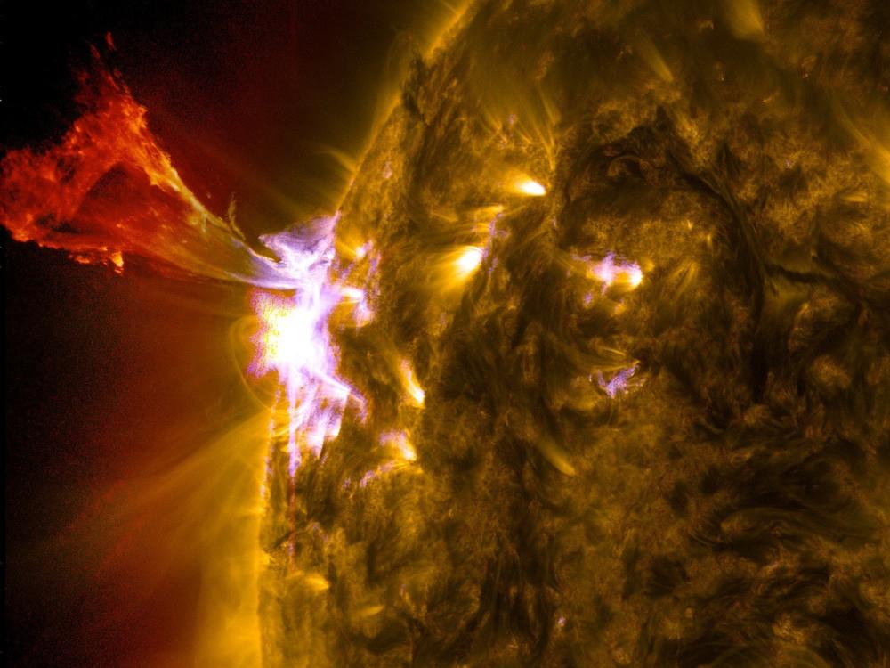 The sun emits a mid-level solar flare releasing a burst of solar material.<strong></strong>