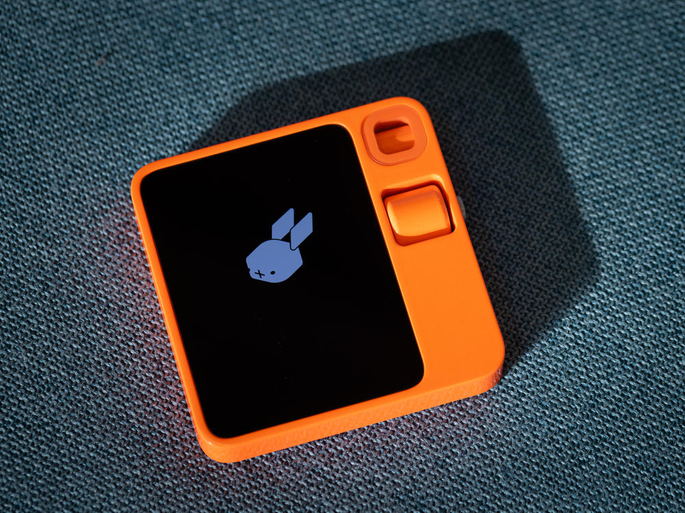 The AI-powered Rabbit R1 device is seen at Rabbit Inc.'s headquarters in Santa Monica, California. The gadget is meant to serve as a personal assistant fulfilling tasks such as ordering food on DoorDash for you, calling an Uber or booking your family's vacation.
