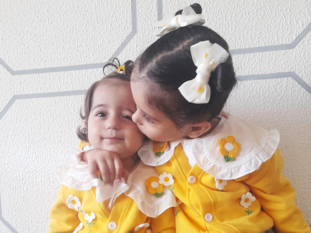 Masa, 2, and Lina, 4, together.