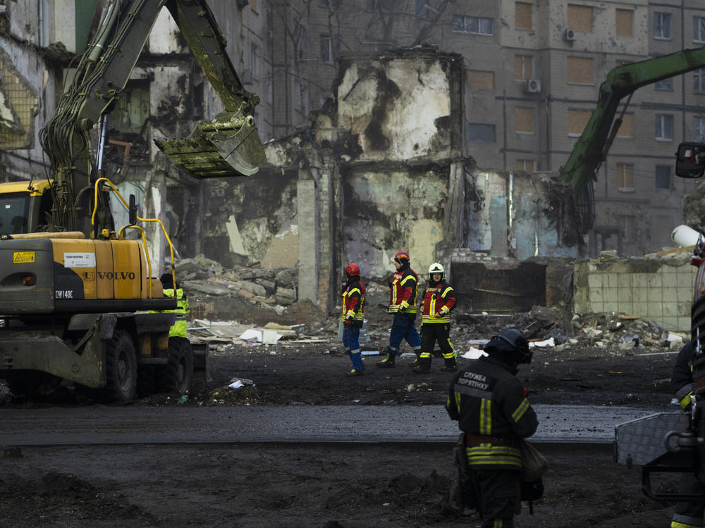 Crews search the rubble for people who remain missing after a Russian missile attack in Dnipro in January 2023.