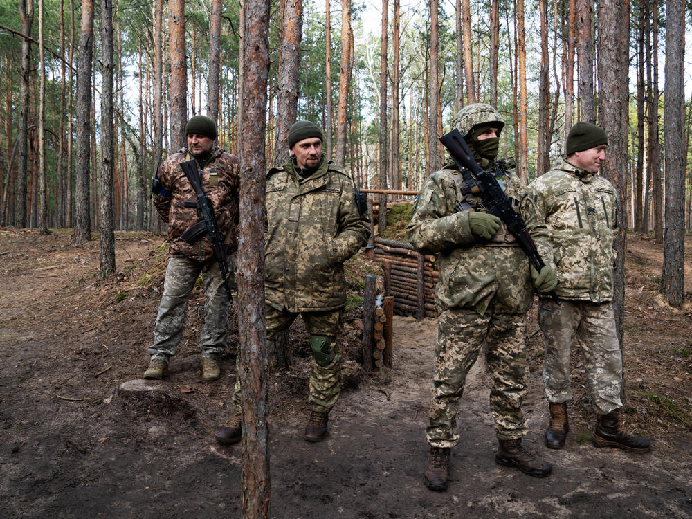 A group of soldiers monitor the Belarusian border in Ukraine's Volyn oblast in March.