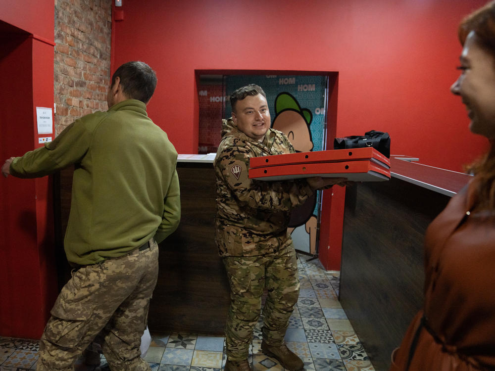Soldiers visit Om-Nom-Nom, a sushi and pizza restaurant in Sloviansk, in eastern Ukraine, in November. Sushi restaurants are popular throughout Ukraine.