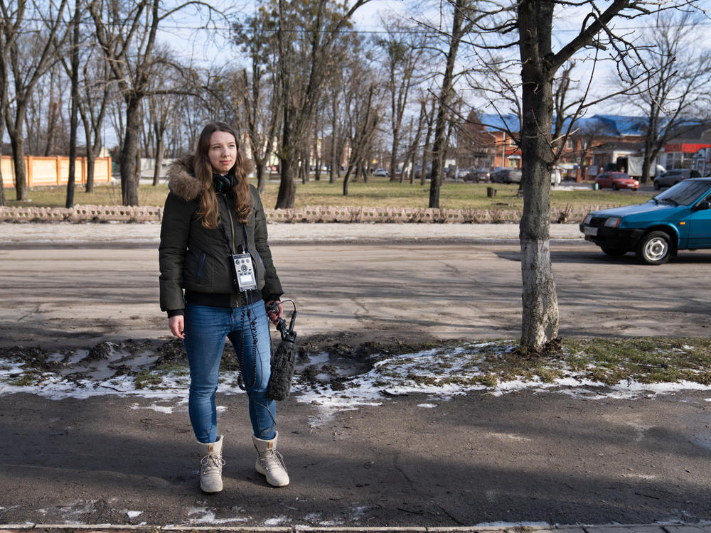 Lytvynova stands in Krasnopillya, a town in Ukraine's Sumy region near the Russian border, while reporting in February.