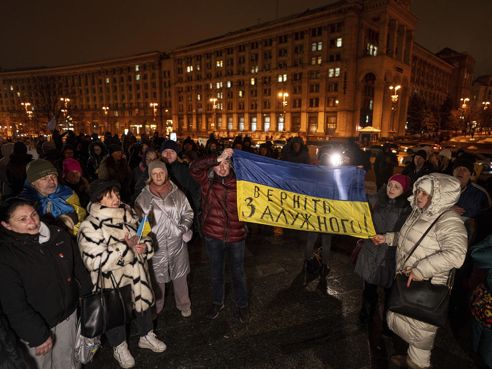 Demonstrators hold a Ukrainian flag during a protest a day after the resignation of Gen. Valeriy Zaluzhnyi at Independence Square in Kyiv, Ukraine, on Feb. 9.