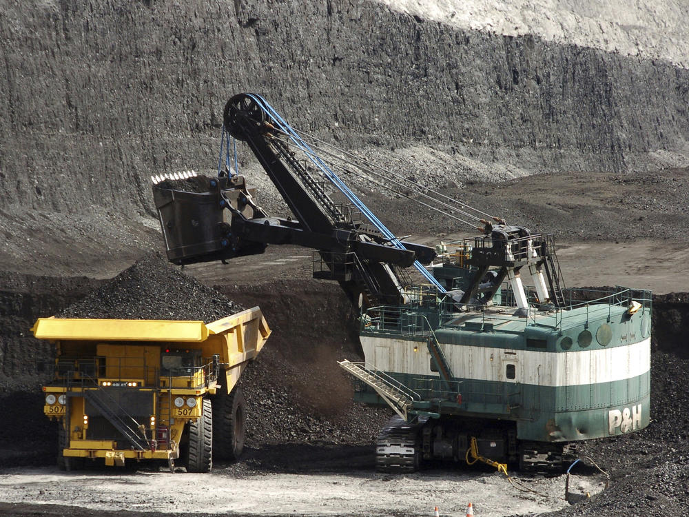 FILE - A mechanized shovel loads a haul truck that can carry up to 250 tons of coal at the Spring Creek coal mine, April 4, 2013, near Decker, Mont. On Wednesday, Feb. 21, 2024, a U.S. appeals court struck down a judge's 2022 order that imposed a moratorium on coal leasing from federal lands. (AP Photo/Matthew Brown, File)