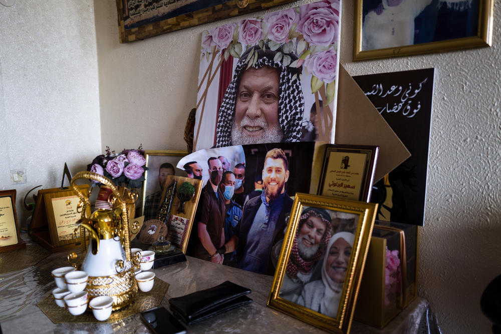 Suheir Barghouti's living room has been turned into a shrine filled with posters of her sons and her late husband, all involved to varying degrees in the conflict and linked to Hamas. Shortly after Saleh Barghouti was killed by Israel in 2018, his brother shot and killed Israeli soldiers. He's now serving a life sentence.