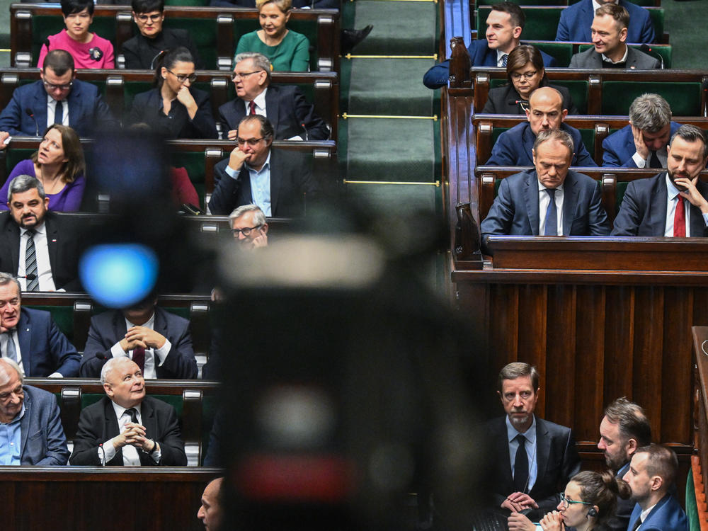 The leader of the conservative Law and Justice Party, Jaroslaw Kaczynski (left bottom), looks at Poland's prime minister, Donald Tusk (right), during a parliament session on Jan. 26, in Warsaw.