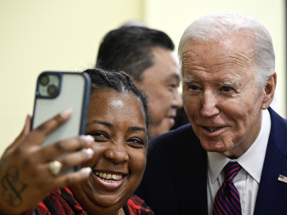 President Biden takes a selfie with a customer at CJ's Cafe in Los Angeles, Calif. on Feb. 21, 2024.