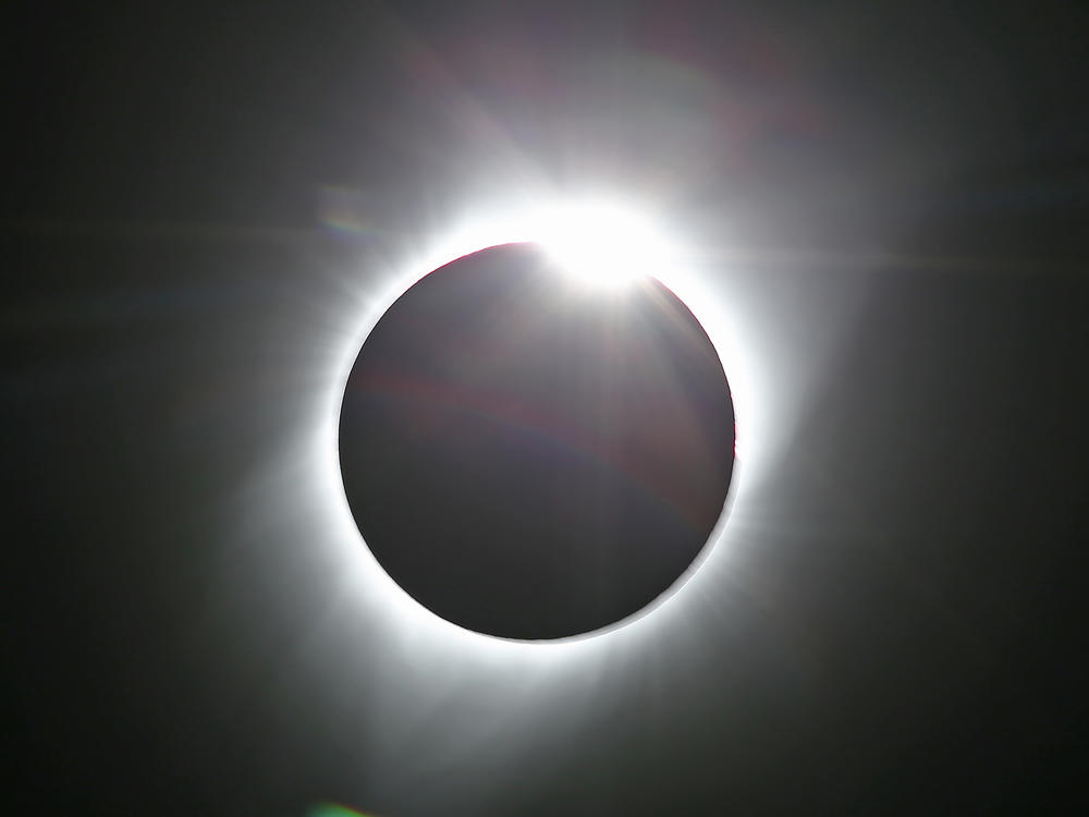 The sun is shown in the first phase of a total eclipse in this photo taken in August 2017 from Grand Teton National Park outside Jackson, Wyo.
