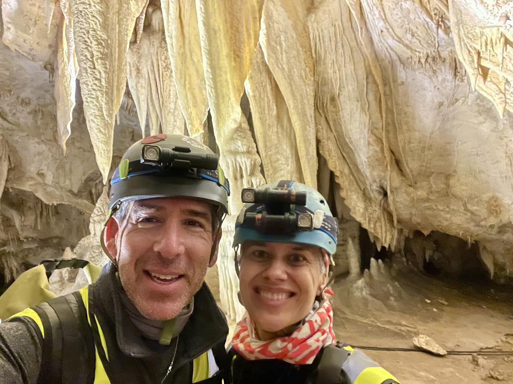 Katheryn Jager and Garrett Smith, pictured inside Honey Creek Cave in Texas in 2023. Jager says the two bonded over their love of outdoor adventures and will go caving immediately after their leap day wedding.