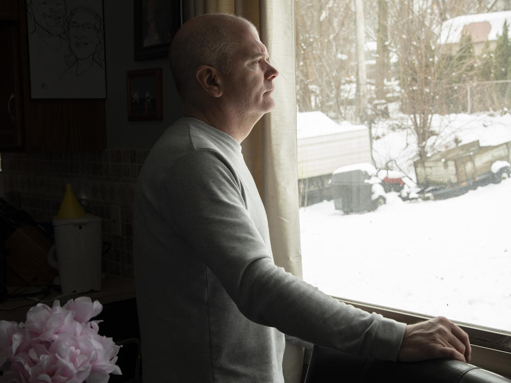 Tim Lillard at the home he and his late wife, Ann Picha-Lillard, shared in suburban southeast Michigan. Since her death in 2022, Lillard has made it his mission to pass the Safe Patient Care Act, which would create mandatory nurse-to-patient ratios in Michigan hospitals.