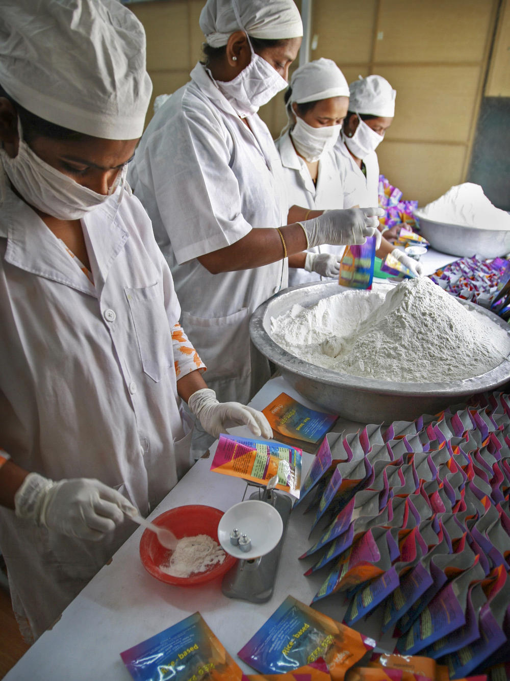 Health workers  prepare oral rehydration salts at the International Center for Diarrheal Disease Research hospital in Dhaka, Bangladesh.