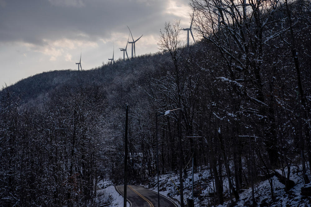The wind turbines near Pinnacle Wind Farm dot the ridge.