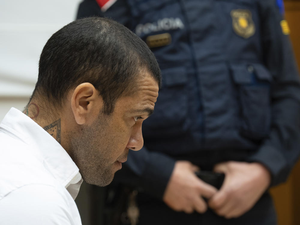Brazilian soccer star Dani Alves sits during his trial in Barcelona, Spain, on Feb. 5, 2024. Alves has been found guilty of sexually assaulting a young woman in a Barcelona nightclub and has been sentenced Alves to 4 1/2 years in prison.