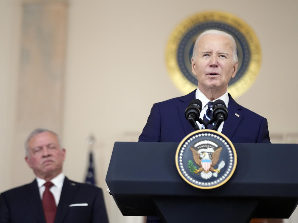 President Biden speaks with Jordan's King Abdullah II in the Cross Hall of the White House on Feb. 12 in Washington.