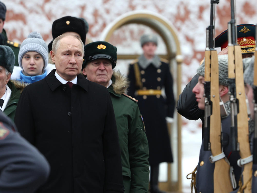 Russian President Vladimir Putin takes part in a wreath-laying ceremony at the Tomb of the Unknown Soldier in Alexander Garden on Defender of the Fatherland Day, in Moscow, Friday.