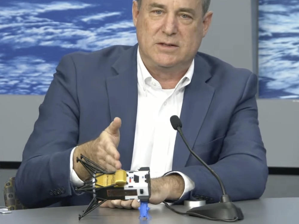In this image from video provided by NASA, Steve Altemus, CEO and co-founder of Intuitive Machines, describes how it is believed the company's Odysseus spacecraft landed on the surface of the moon, during a news conference in Houston on Friday, Feb. 23, 2024.