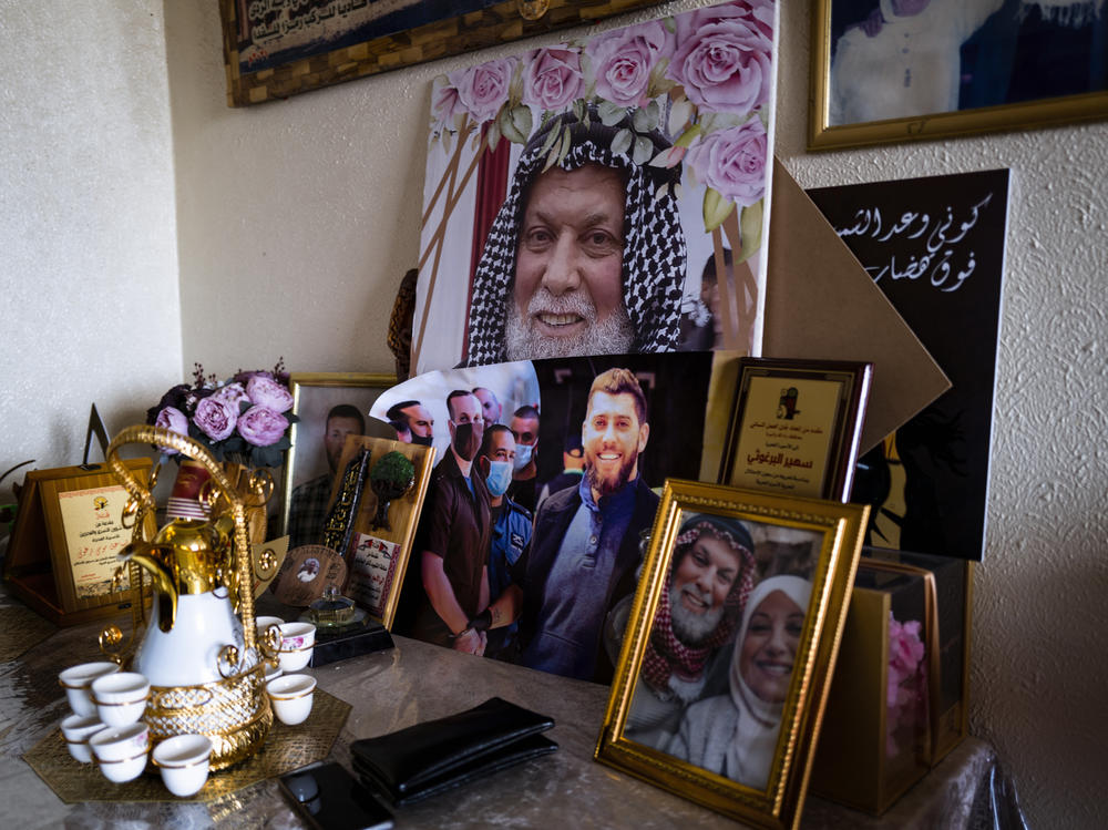 Suheir Barghouti's living room, which she's turned into a shrine filled with posters of her sons and her late husband, all involved to varying degrees in the conflict, in her home in Ramallah.