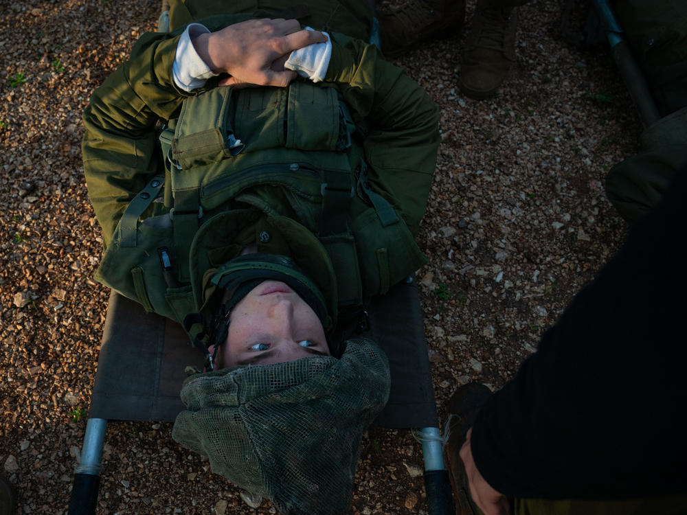 Israeli soldiers practice evacuating wounded people with a helicopter during a military drill in northern Israel on Tuesday, Feb. 20. The Israeli Defense Forces said the exercises reflected new methods developed while evacuating wounded soldiers in Gaza during the current conflict.