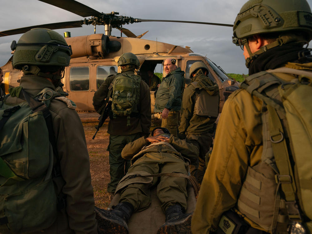 Israeli soldiers practice evacuating wounded people with a helicopter during a military drill in northern Israel on Tuesday, Feb. 20, in an effort to prepare for a potential escalation in the conflict between Israel and Hezbollah in Lebanon.