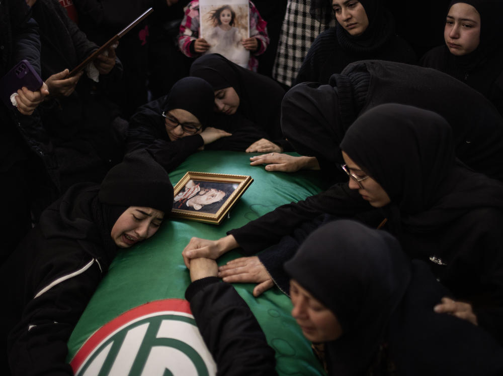 Relatives of Amal Hassan Al Durr, a 5-year-old girl, grieve her loss after she was killed during an Israeli attack Thursday, Feb. 22, in Majdal Zoun, Lebanon. Amal was playing outside her uncle's house with her mom and her sister. Khadija Salman, a 40-year-old woman, was also killed in the same attack.