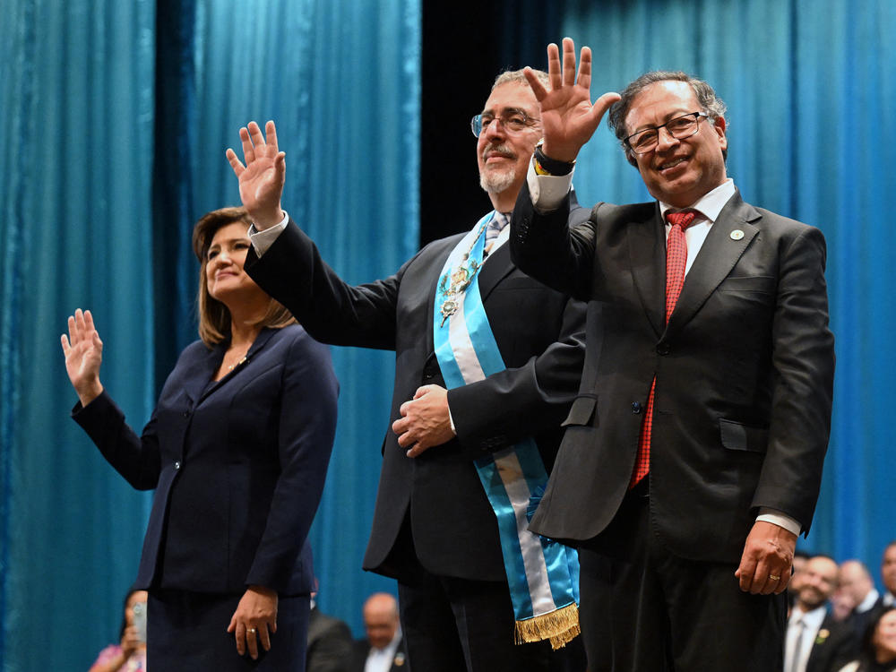 Guatemala's new president, Bernardo Arévalo (center), with new Vice President Karin Herrera (left) and Colombian President Gustavo Petro, waves during his inauguration ceremony at the Miguel Ángel Asturias Cultural Center in Guatemala City on Jan. 15.