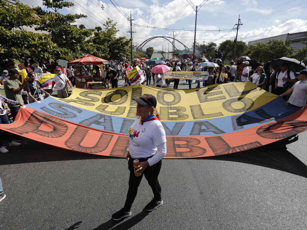People take part in a rally in support of Colombian President Gustavo Petro in Medellín, Colombia, on Feb. 8.