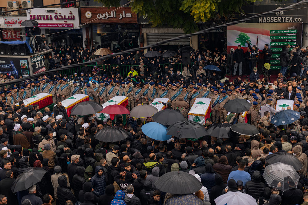 Residents and relatives mourn the loss of seven members of the Berjawi family, on Feb. 17 in Nabatieh.