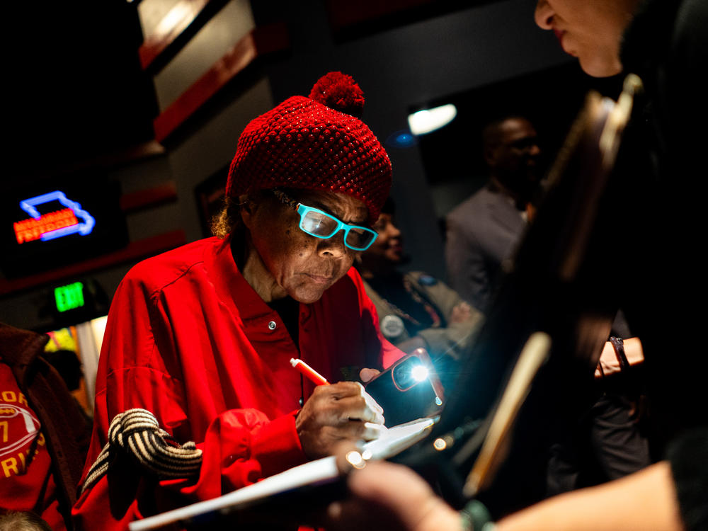 Janice Jernigans, 75, of St. Louis' Hyde Park neighborhood, signs a petition for a Missouri constitutional amendment that would legalize abortion up until fetal viability on Feb. 6 at The Pageant in St. Louis.
