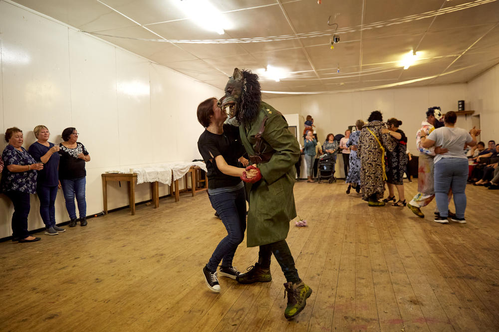 The Okalolies take part in a traditional Pillow Dance after arriving at Prince Phillip Hall. It's only now that the Okalolies finally reveal themselves. Then, it's time for dancing, barbecues — or <em>braais</em>, as they're known on Tristan — and, at midnight, the ringing of the fishing gong, an old gas bottle suspended from a rope and hit with a hammer or metal bar.
