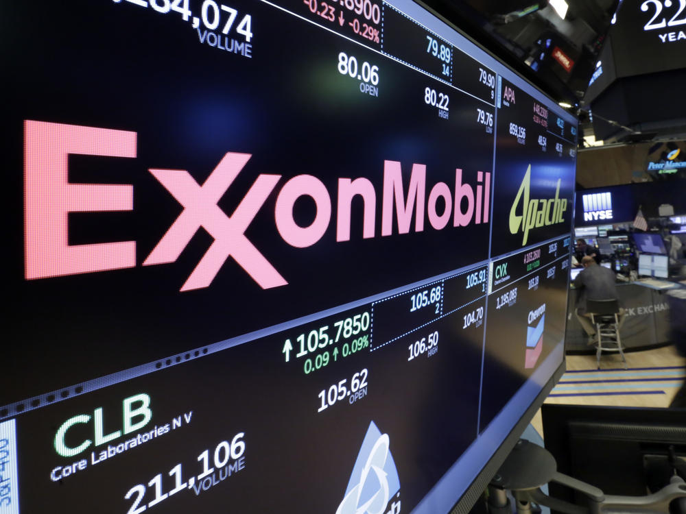 The ExxonMobil logo appears above a trading post at the New York Stock Exchange.