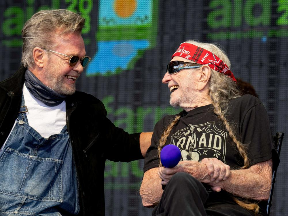 John Mellencamp and Willie Nelson, seen here at Farm Aid last year, will headline the 2024 Outlaw Music Festival tour.