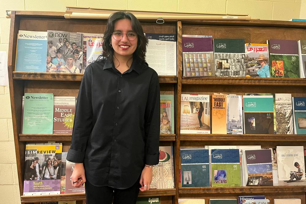 Rania Umer, pictured at Wayne State University in Detroit, is eligible to vote for the first time in November but doesn't plan to do so.