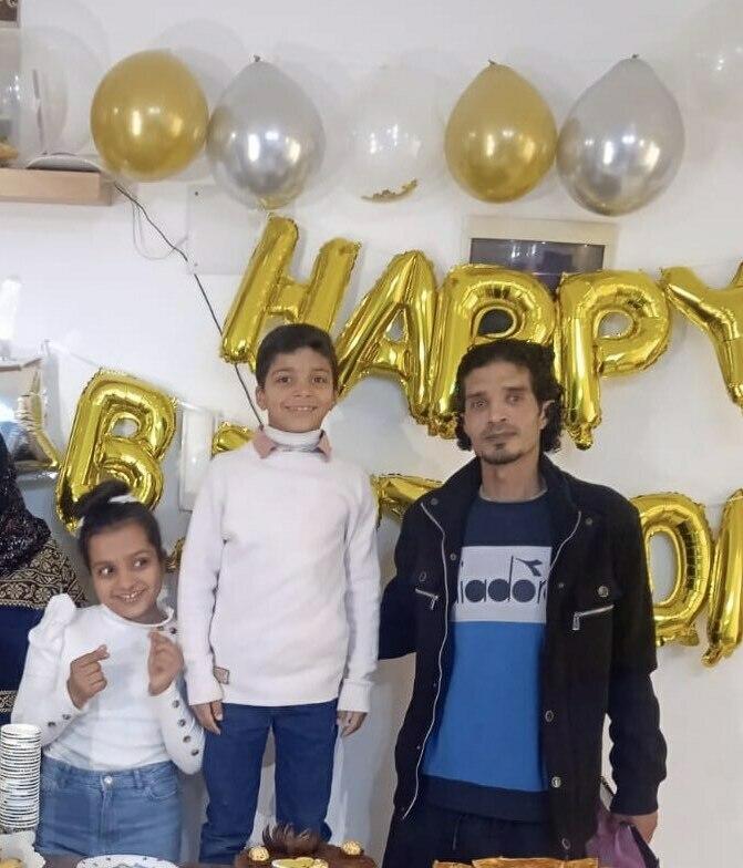 Eman Abusaeid's children, Joudi and Ziyad, and her husband, Iyad. Everyone in the photo was killed in an airstrike Oct. 31, 2023.