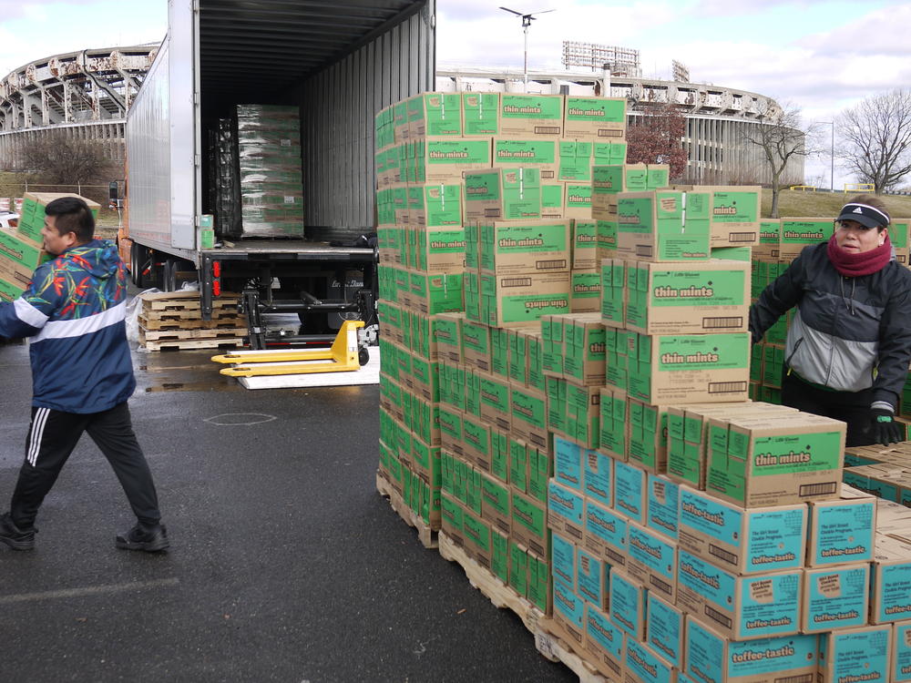 Cookie pickup day is a test of logistics for Girl Scout parents, who fill their cars with as many cookies as they can hold.