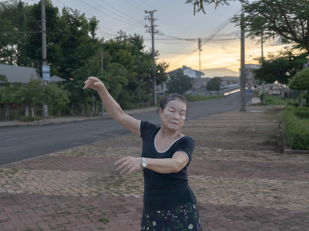 For an hour each evening, Nguyen brings her small radio to the river and performs a dance similar to the tango.