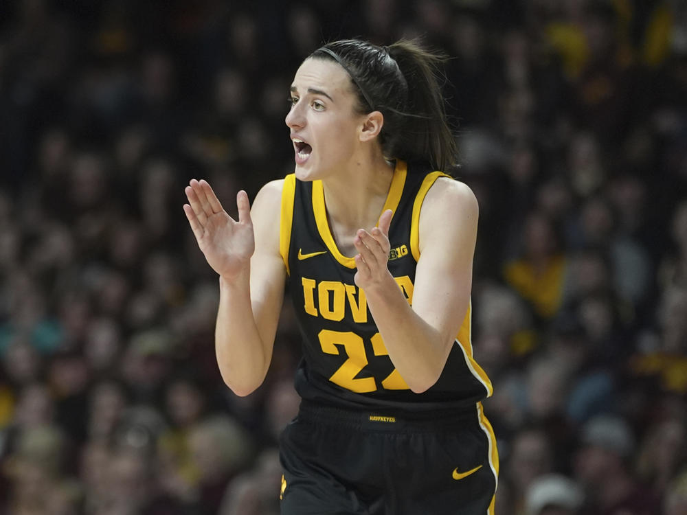 Iowa guard Caitlin Clark claps during the second half of a game against Minnesota on Wednesday in Minneapolis.