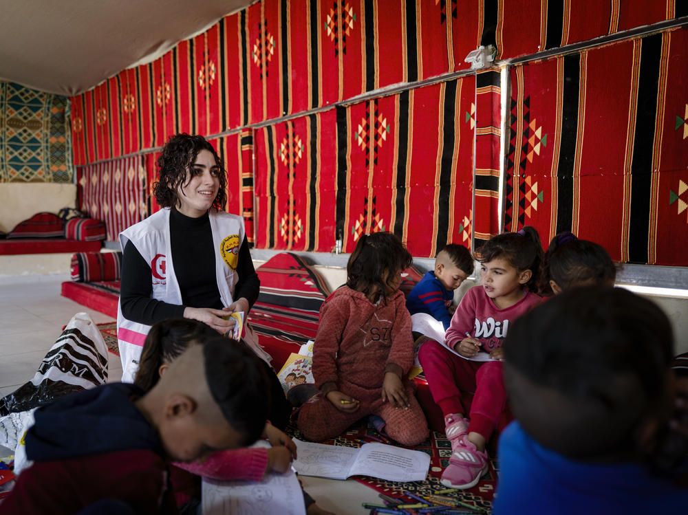Psychologist Redah Hussin leads an art therapy class for Bedouin children. Between an uptick in settler violence and the war in Gaza, Palestinians are dealing with multiple mental health stressors.