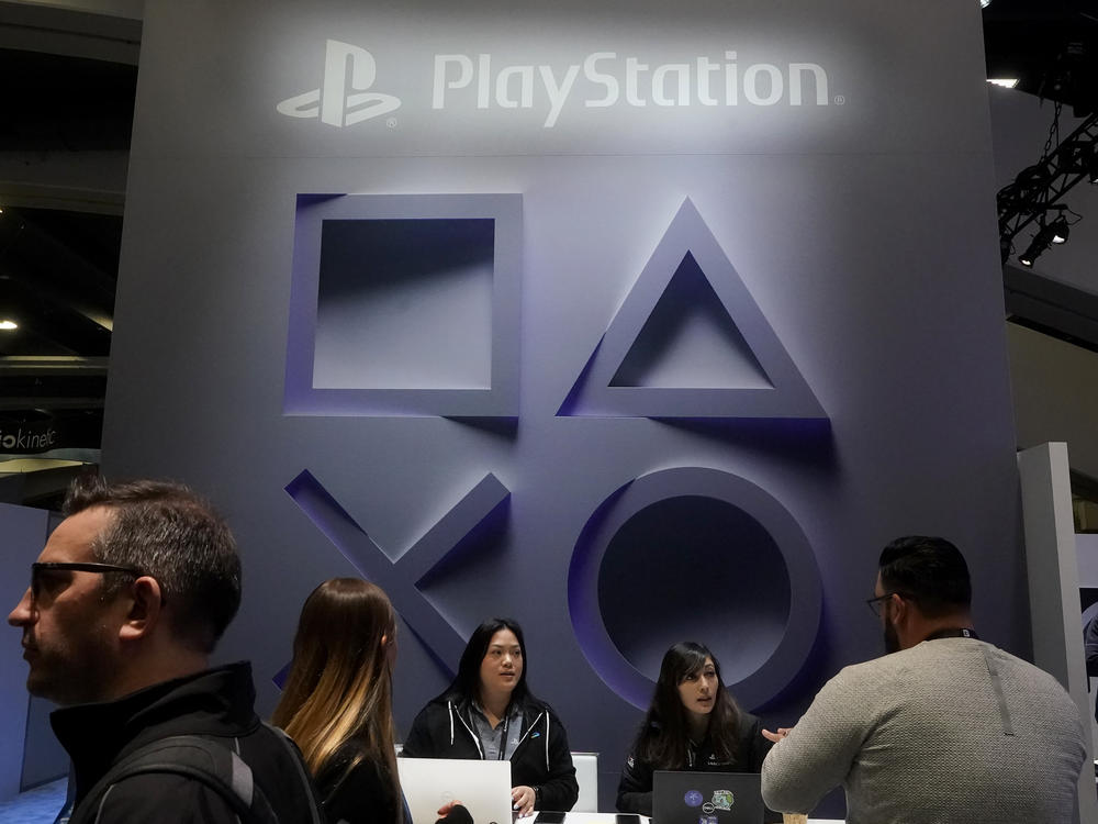 Attendees visit the PlayStation booth at the Game Developers Conference 2023 in San Francisco, Wednesday, March 22, 2023.