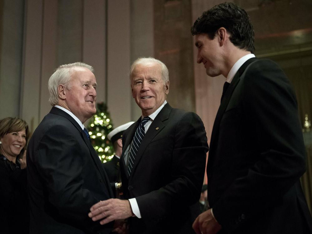 Former Canadian Prime Minister Brian Mulroney, left, greets then-U.S. Vice President Joe Biden and Prime Minister Justin Trudeau as they arrive at a state dinner, Thursday, Dec. 8, 2016, in Ottawa, Ontario.