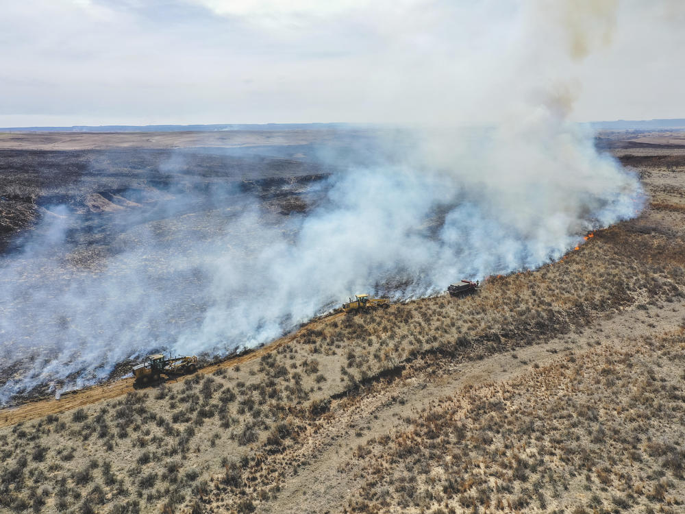 Firefighters battle the Smokehouse Creek Fire north of Canadian, Texas, on Wednesday, Feb. 28, 2024.