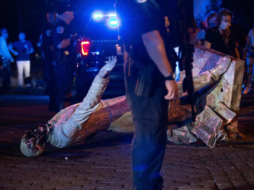 A statue of Confederate States President Jefferson Davis lies on the street after protesters pulled it down in Richmond, Virginia, on June 10, 2020.